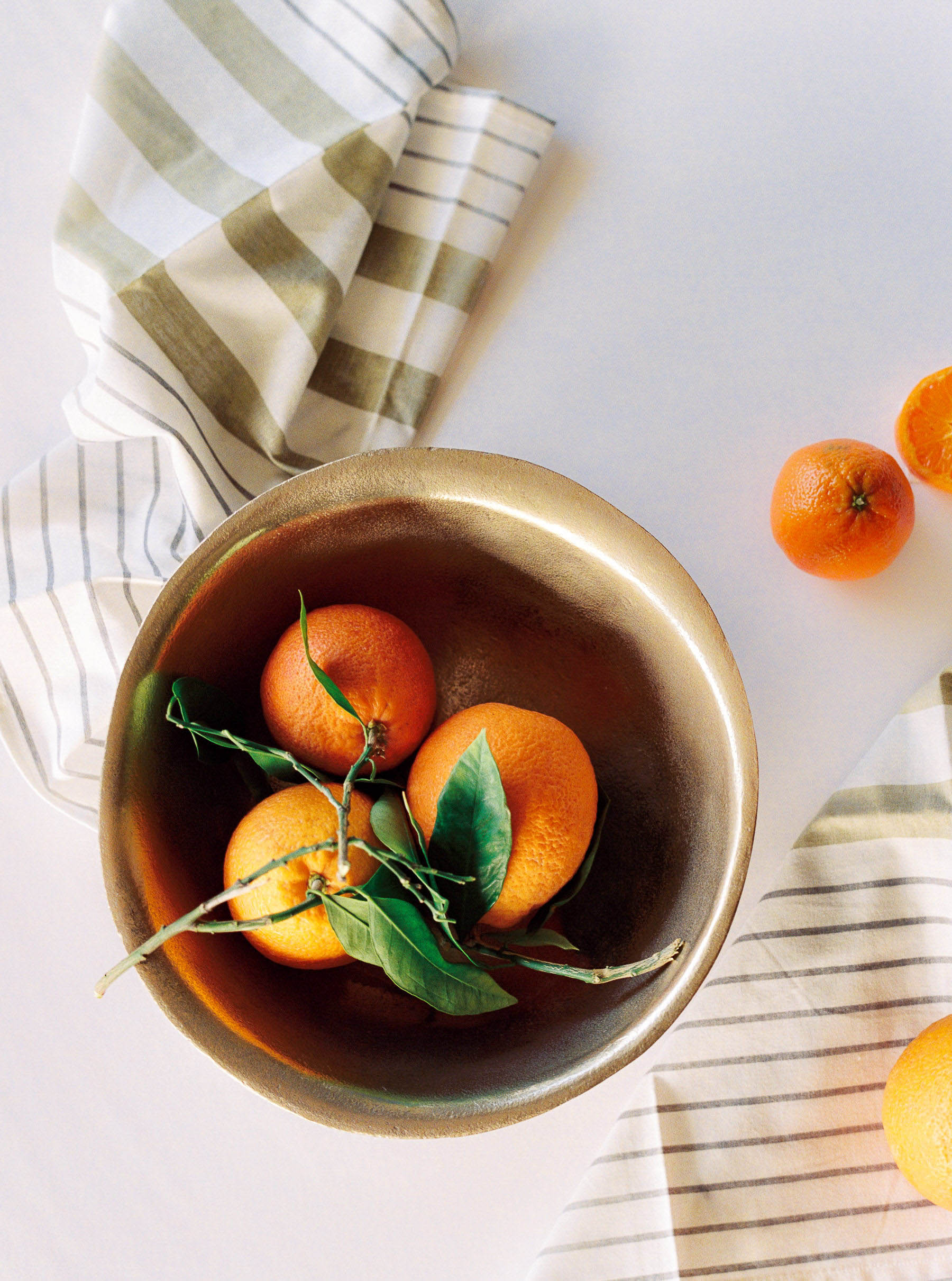 bowl of clementines and stripped kitchen towels